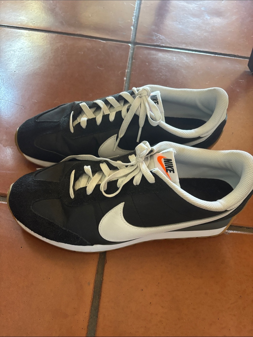Nike Women's Black and White Retro Runner with Orange Tongue Logo